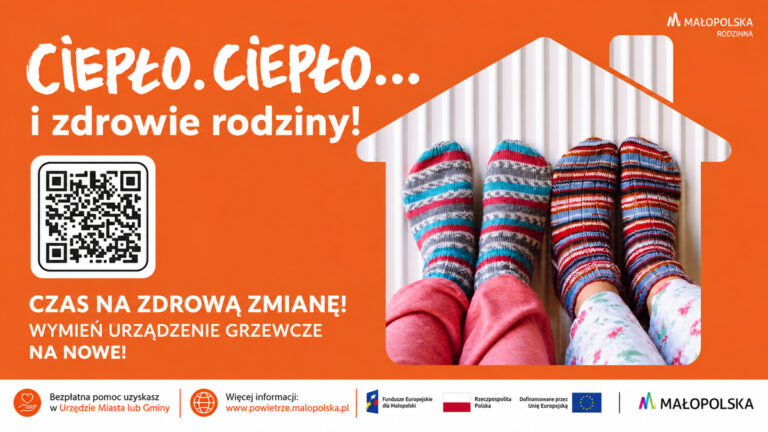 Stopy w kolorowych skarpetach na grzejniku i zachęta do wymiany urządzenia grzewczego